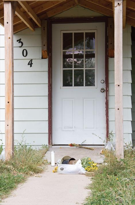 Flowers have been left on the doorstep of St. John’s home in Polson.