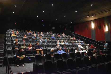 Patrick Yawakie, right, speaks to audience members before the film is shown.