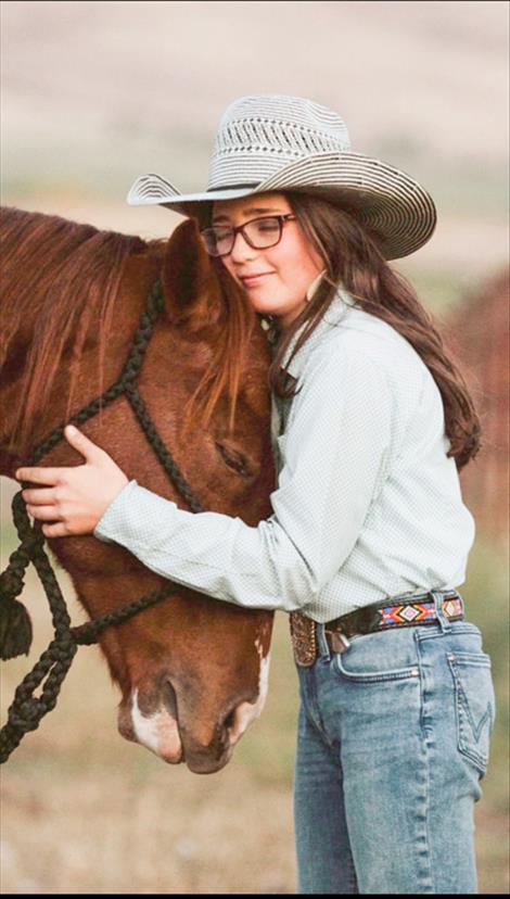 Graysen hugs her horse “Fancy” earlier this year.