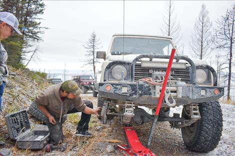 A tire hub problem, lower right, proved too difficult to repair on the mountainside so one off-roader had to turn back for the day.