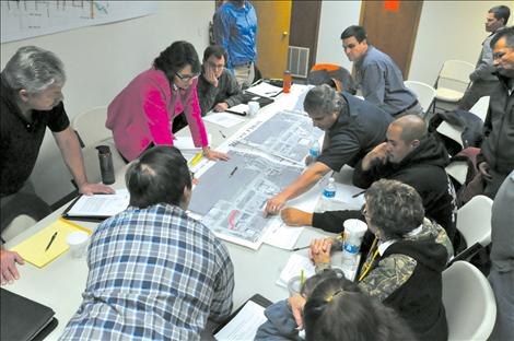 Members of the Ronan City Council look at alternatives to a Frontage Road in the proposed Highway 93 expansion with state and federal officials. 