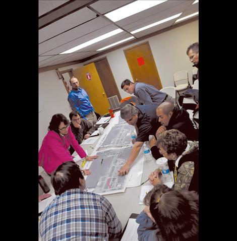 Members of the Ronan City Council look at alternatives to a Frontage Road in the proposed Highway 93 expansion with state and federal officials. 