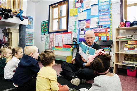 Gov. Gianforte reads to children at a day care center in Helena in 2023.