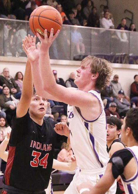 Brock Henriksen shoots a jumper.