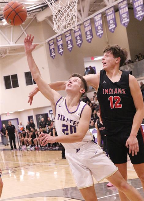 Maddox Bird twists for a layup in a Jan. 4 basketball game hosted by Browning. 