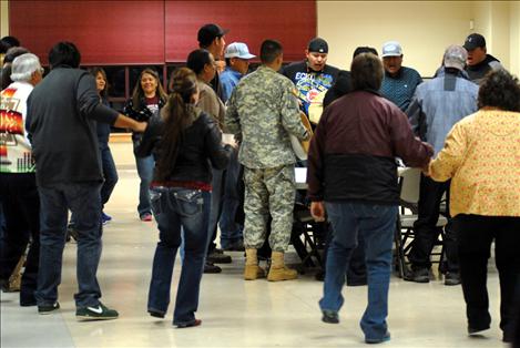 Participants in Friday's Round Dance at Salish Kootenai College circle a group of hand drummers.