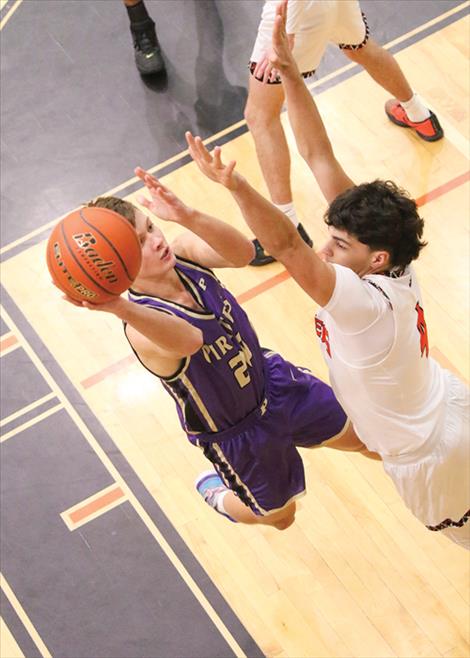 Polson Pirate basketball player Maddox Bird goes in for a layup during a Jan. 16 game against the Ronan Chiefs. The Chiefs came away with the win 73-54.