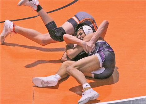 Polson wrestler Max Ramesar, 126, pins a Ronan wrestler during a Jan. 16 contest hosted in Ronan.