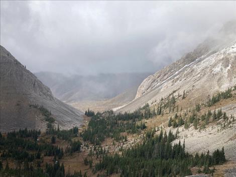 Pictured above is the view looking out over Headquarters Pass located in the Bob Marshall Wilderness Complex. This part of the Complex is managed by the Rocky Mountain Ranger District.