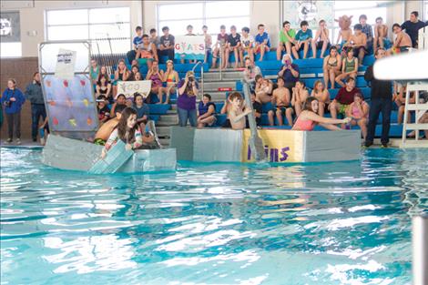 Students learn physics principles in cardboard boat challenge