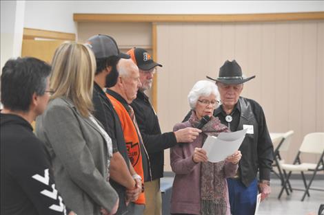 Laurel Cheff reads a letter written by her husband Bud, who could not speak because of a stroke,  about all the people that made the Ninepipes Museum of Early Montana possible.