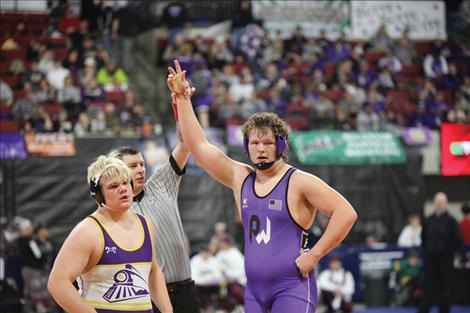 Brody Bulette of Polson wins a match at the state wrestling tournament.