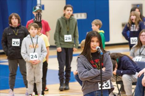 Ariana Davis, an Arlee fifth grader, spells a word during round 1.