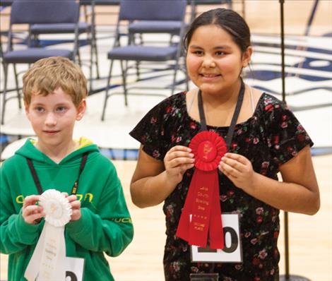 Fifth grader Boston Evans, left, tied for third place. Erianna Fat Lip, right, came in second place at the 2024 Lake County Spelling Bee.