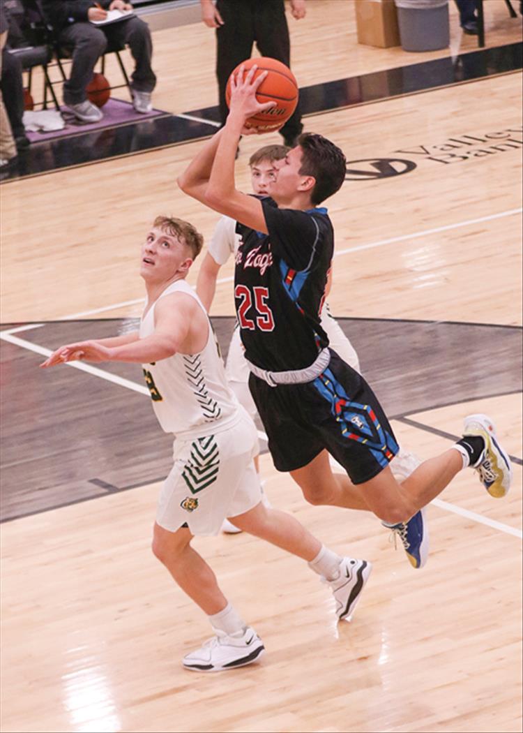 Jabez Madplume takes a shot against St. Regis in the championship game played at Polson. St. Regis won 64-53.