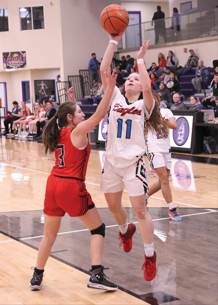 Lady Eagle Jodessa McGreevey goes for a layup in a game against Noxon at the 14C District tournament.