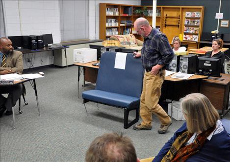 Rob Tougas, director of transportation for Ronan School District, used a bus seat as a visual aid during a presentation at the Nov. 11 board meeting. 