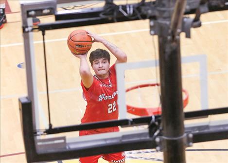 Arlee’s Jace Arca puts up a jump shot in the key during last weekend’s Class B divisional tournament at SKC.