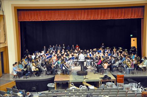 Guest conductor Dusty Molyneaux directs students from across Mission Valley at the fourth annual band festival. 