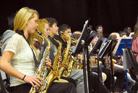 Saxophone players from bands across Mission Valley came together to perform an ensemble with other instrument sections at the Mission Valley Band Festival.