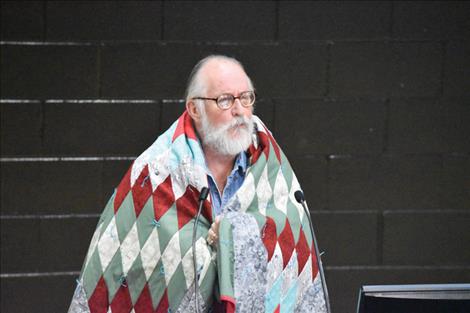 Wrapped in a star quilt he was gifted, Frank Tyro shares his gratitude for the opportunity “to spend for 55 years doing something I have loved doing.”