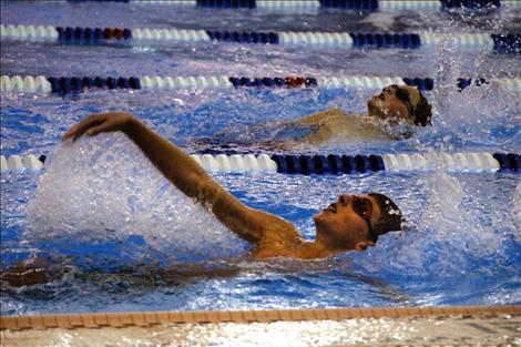 Swimmers work on their backstroke during practice. The Lake Monsters participants range in age from 6 years old to 20 years old.