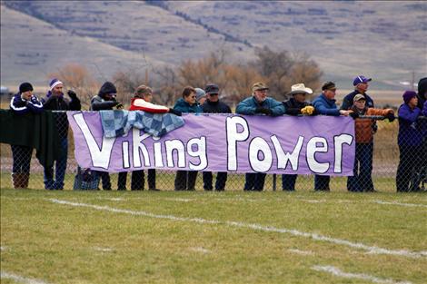 Vociferous fans line the fence for Saturday’s semi-final football playoff game in Charlo, where the winner had a chance at the State title. The powerhouse Vikings fought but lost the battle to Ennis High.