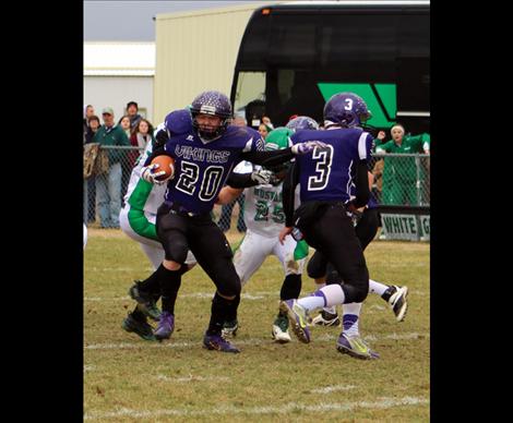 Quarterback Tyler Delaney runs with the ball on the QB option.