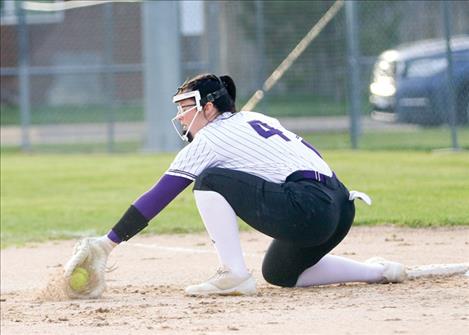 Kailey Smith digs one out at first during a May 11 softball game a