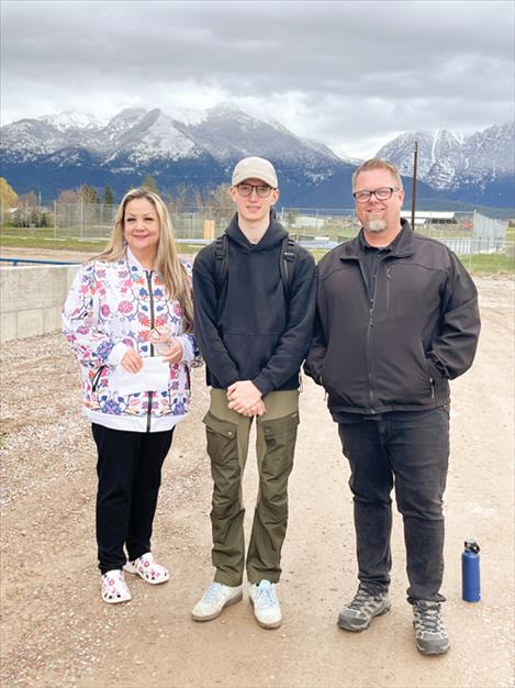 Juanita Swaney (Tobacco Education Specialist from CSKT Tribal Health), Daniel Ament, and Mark Brookman (Tobacco Education Specialist for Lake County) pose for a photo outside St. Ignatius schools.