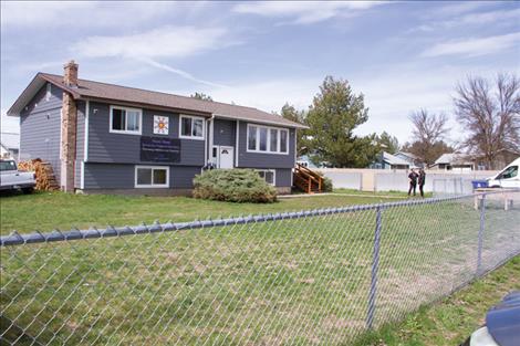 Attendees are greeted as they arrive to the The Never Alone Recovery Village Hub open house in Pablo last week.