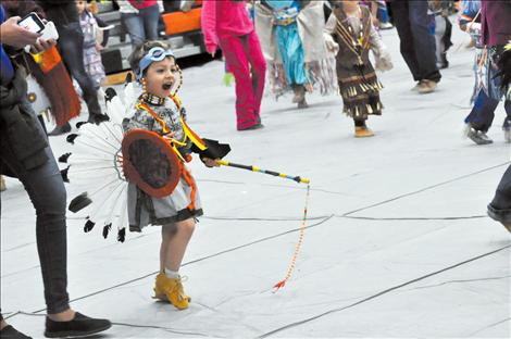 Gianni Moreno screams excitedly as he dances in the Headstart Powow.