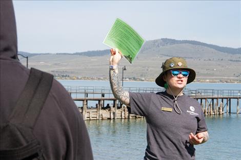Sophie Nacer with Montana Fish, Wildlife and Parks talks to students about the features that make certain plants and animals invasive such as adaptability, speed at which they spread and impact on other organisms and the environment. 