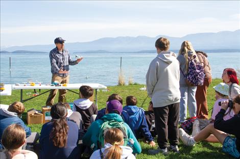 Phil Matson, a research coordinator with the Flathead Lake Biological Station, explains to students how easy it is to unknowingly transport microscopic mussel larvae (veligers) as they can survive in standing water for three days. Clean, drain and dry are the aquatic invasive species prevention steps for anyone bringing watercraft to Montana waters. 