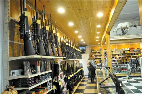 Elijah Corrigan waits on a  customer in the Westland Seed sporting goods department. The department has hundreds of 