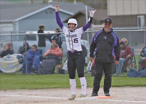 Emma Smith celebrates key hit driving in runs.