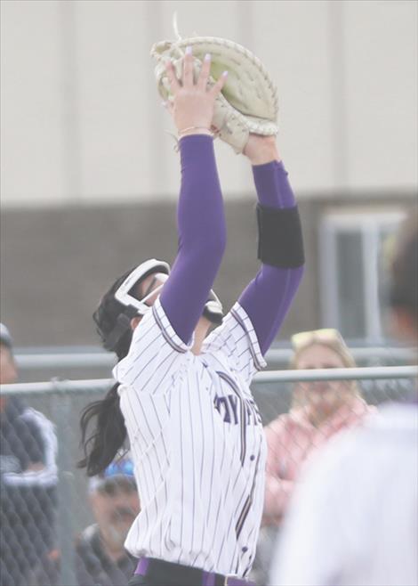 Lady Pirate and first base player, Kailey Smith squeezes a pop up during the May 2, game against Ronan.