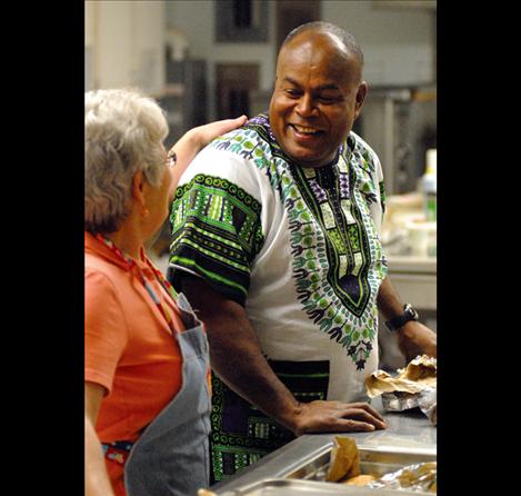 Emosi Tatukivei jokes with Coral Lockwood at the Barn Dance and spaghetti feed fundraiser Saturday in Ronan held for missionaries headed to Guinea Bissau, West Africa. In December, the Tatukivei family will be heading back to Africa with a group of local Youth With A Mission students.