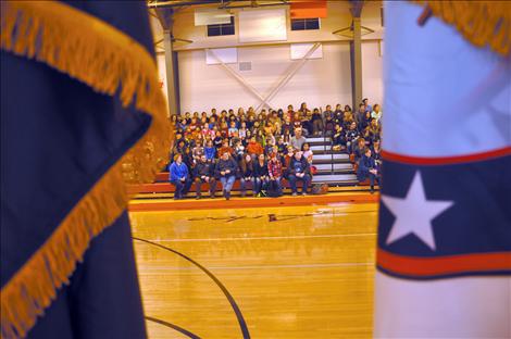 Arlee students listen to a presentation by Sgt. Chuck Lewis about why flags should be respected.