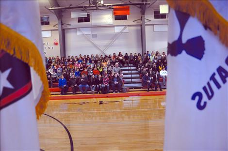 Arlee students listen to a presentation by Sgt. Chuck Lewis about why flags should be respected.