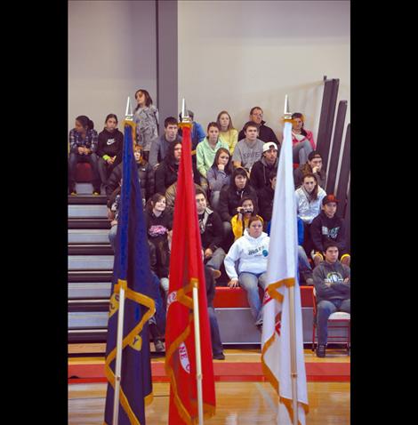 Arlee students listen to a presentation by Sgt. Chuck Lewis about why flags should be respected.