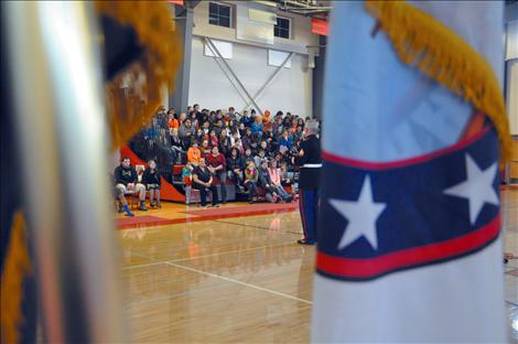 Arlee students listen to a presentation by Sgt. Chuck Lewis about why flags should be respected.