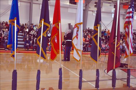 Arlee students listen to a presentation by Sgt. Chuck Lewis about why flags should be respected.