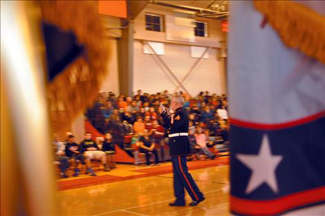 Arlee students listen to a presentation by Sgt. Chuck Lewis about why flags should be respected.