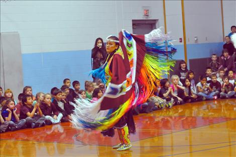 Randi Auld and Blue Sky FireStrike dance and share native heritage with students at K. William Harvey Elementary School. 
