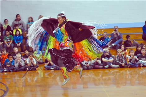 Randi Auld and Blue Sky FireStrike dance and share native heritage with students at K. William Harvey Elementary School. 