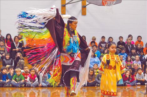 Randi Auld and Blue Sky FireStrike dance and share native heritage with students at K. William Harvey Elementary School. 