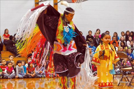 Randi Auld and Blue Sky FireStrike dance and share native heritage with students at K. William Harvey Elementary School. 