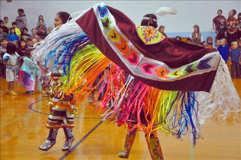 Randi Auld and Blue Sky FireStrike dance and share native heritage with students at K. William Harvey Elementary School. 