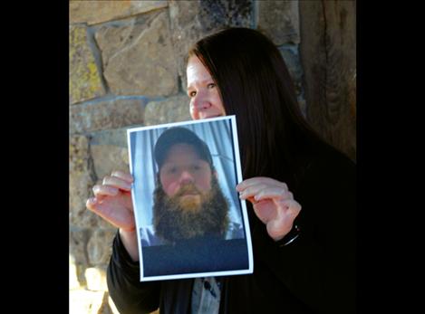 Black Mountain employee Mindy Corrigan shows a photo of herself as a werewolf, saying she doesn’t come to town like that.